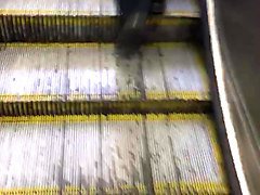 nice booty milf walking up escalator 